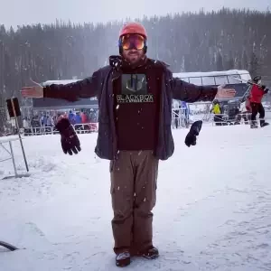 Snowboarder in Colorado wearing our Merchandise